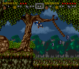 Swinging from a rope slung between two trees in the forest, rings lined up ahead to collect